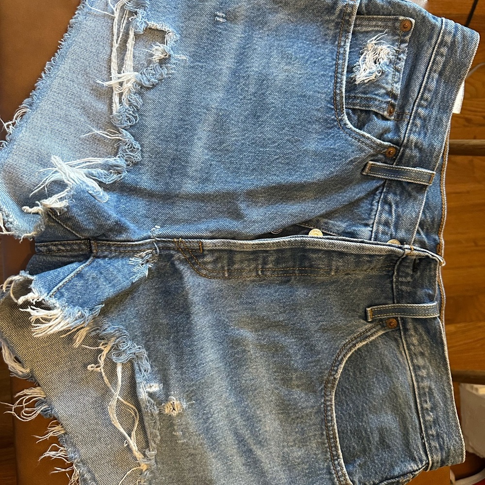 Medium wash Levi 501 denim cutoff shorts